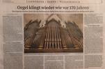 Zu sehen ist ein Zeitungsartikel zur Restaurierung der Orgel.