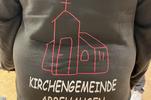 Zu sehen ist die Jacke der Jugendarbeit der Kirchengemeinde Abbehausen.